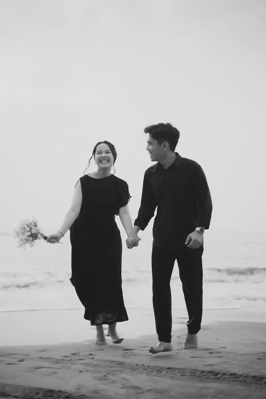 Bastian and Vero smiling on the beach